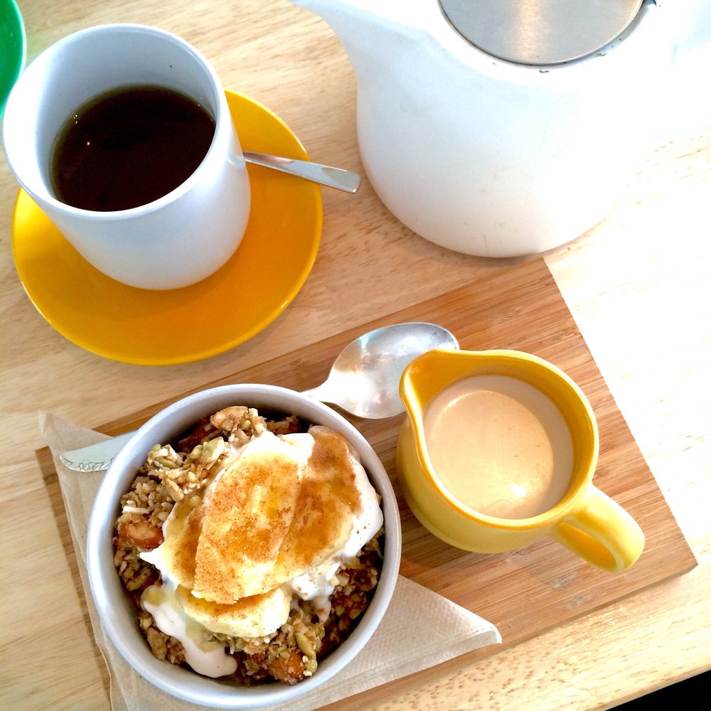 Almond granola with almond milk and banana, with a side of coconut tea | © Jennifer F. / Yelp