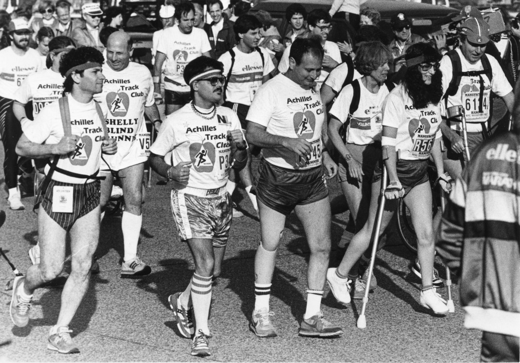 Dick Traum (center) running the 1986 NYC Marathon with members of Achilles Track Club (now known as Achilles International). | © Courtesy of Achilles International