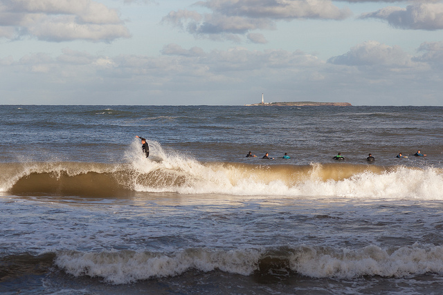 Surfers at El Emir beach, Punta del Este, Maldonado, Uruguay
