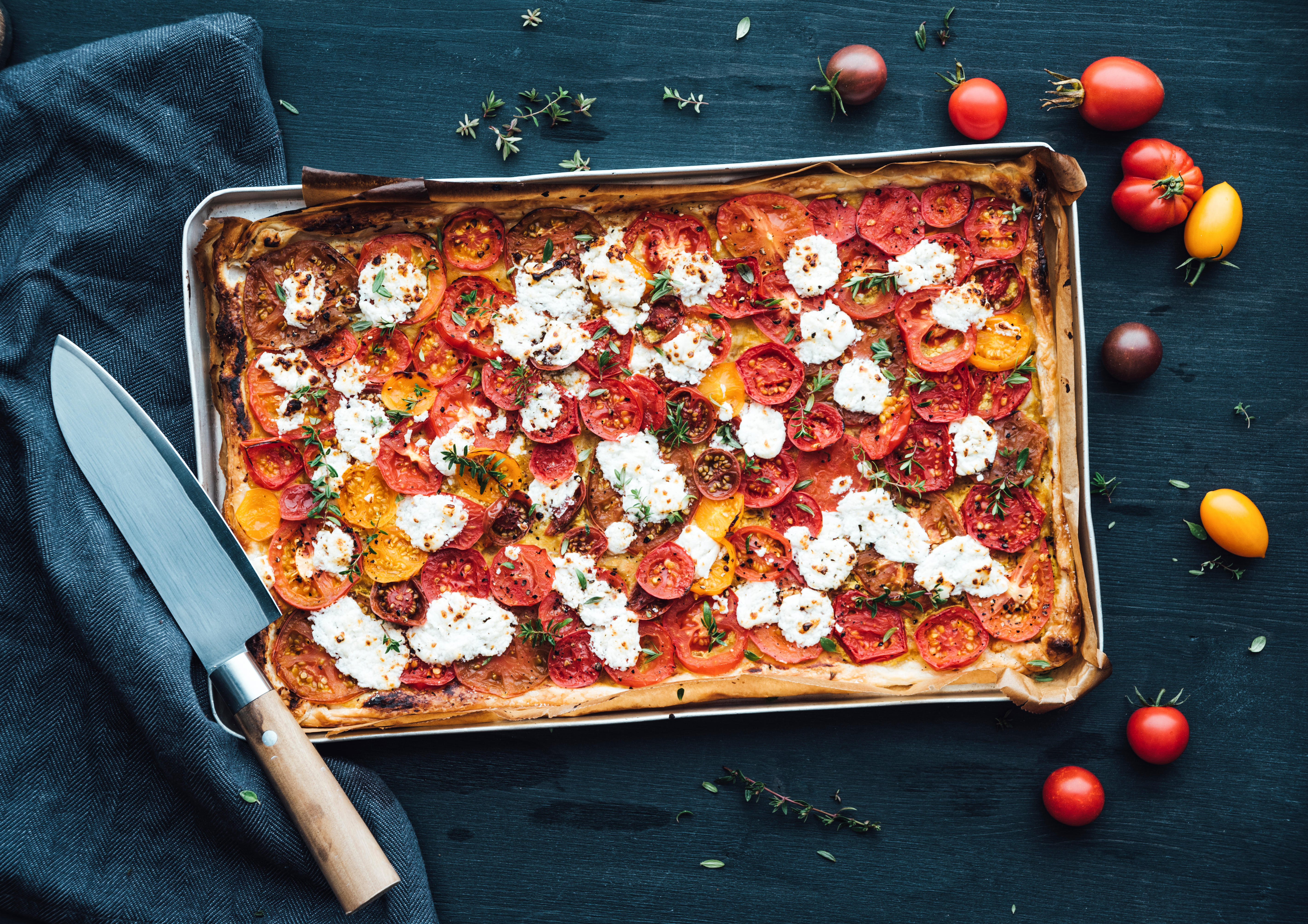 Tomato tart with goat cheese and thyme on mustard